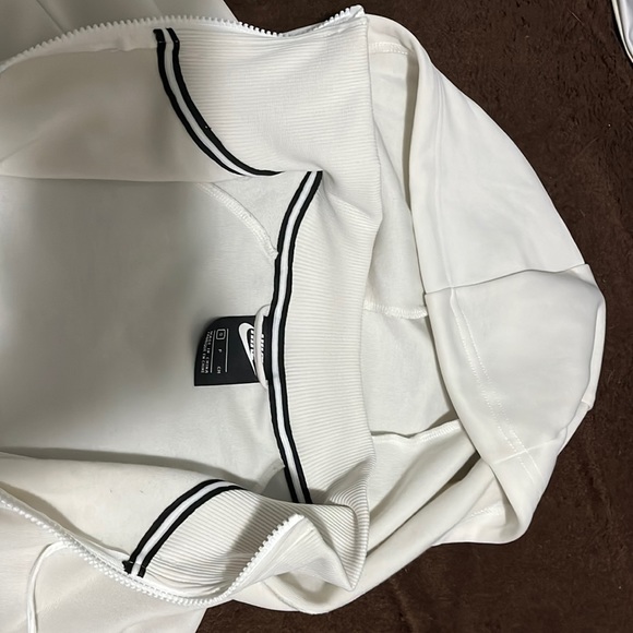 Cream/off-white Nike jacket w/ black and green stripe down the side - Picture 4 of 5